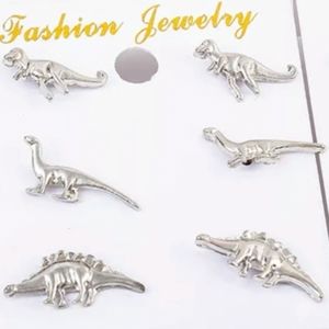 Dinosaur earrings. NWT